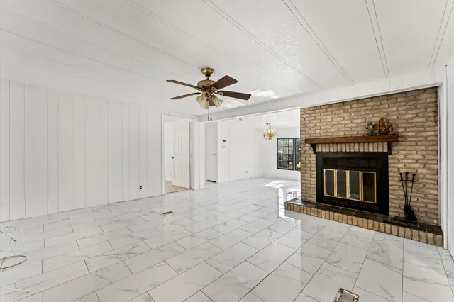 a view of an empty room with a fireplace