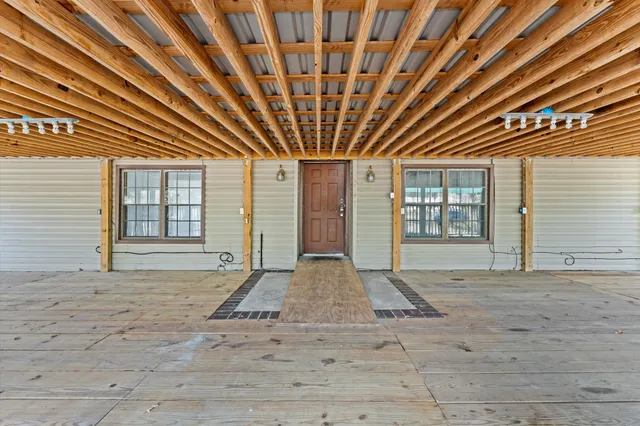 a view of front door with yard