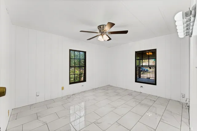 a view of an empty room and window