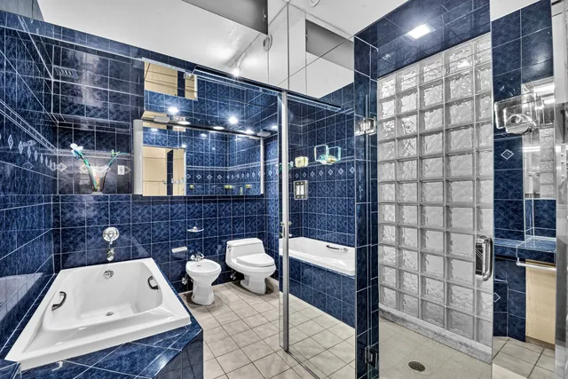 a bedroom with a bed and a mirror