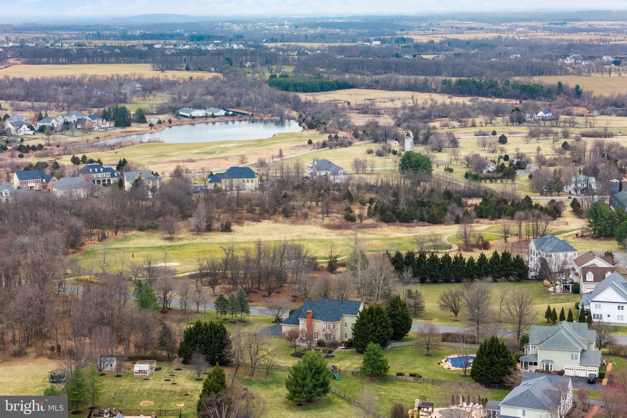 41741 Raspberry Drive Leesburg, VA 20176 - Photo 14 of 117 an aerial view of residential building with outdoor space and lake view