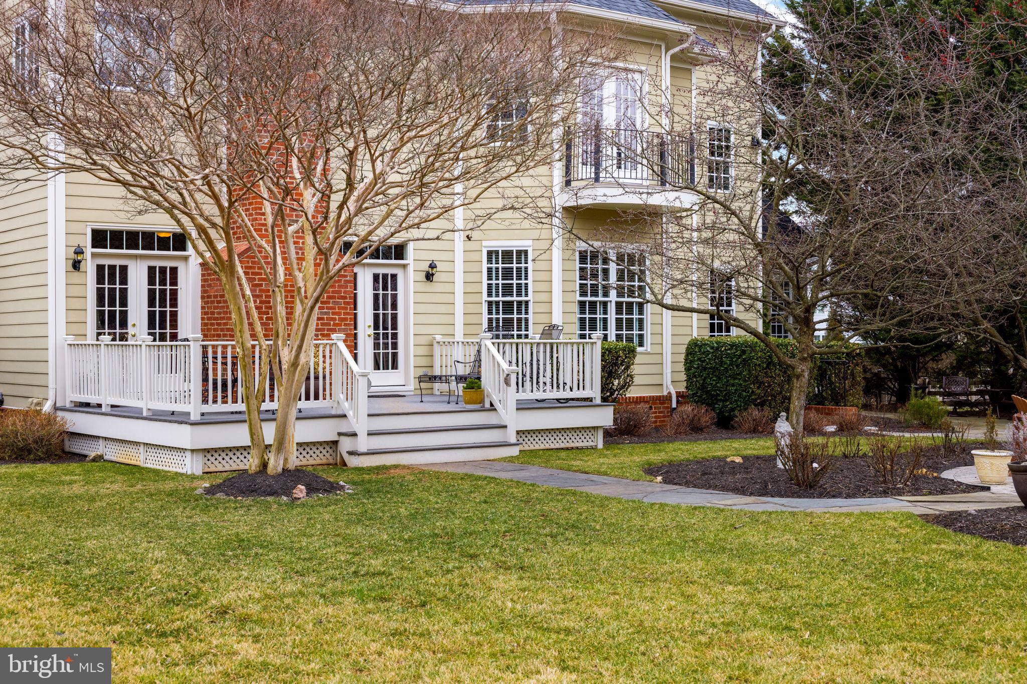 41741 Raspberry Drive Leesburg, VA 20176 - Photo 16 of 117 a front view of a house with a yard table and chairs