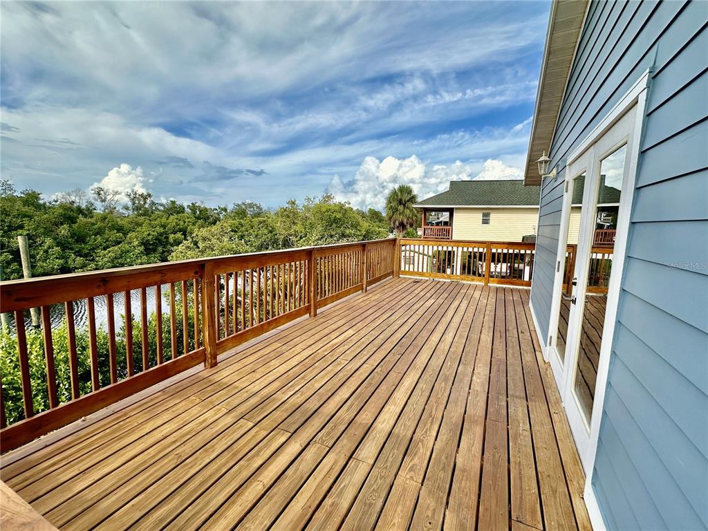 3303 West Shell Point Road, Unit B Ruskin, FL 33570 - Photo 15 of 22 a view of a balcony with wooden floor
