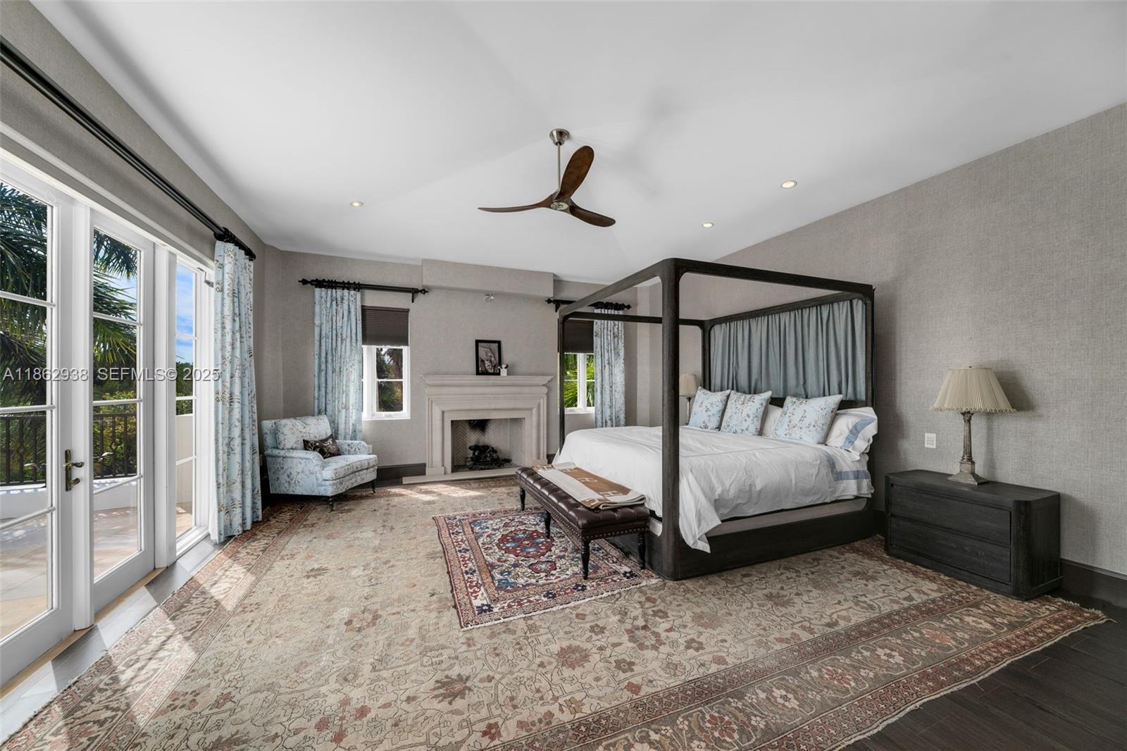 3305 South Moornings Way Miami, FL 33133 - Photo 8 of 19 a bedroom with furniture and a fireplace