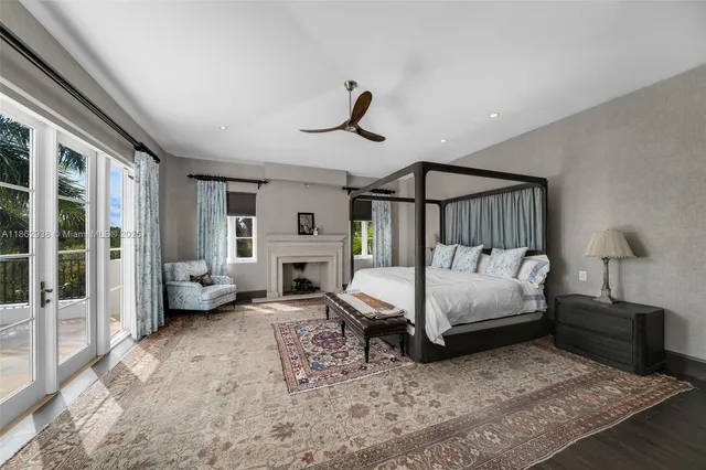 a bedroom with furniture and a fireplace