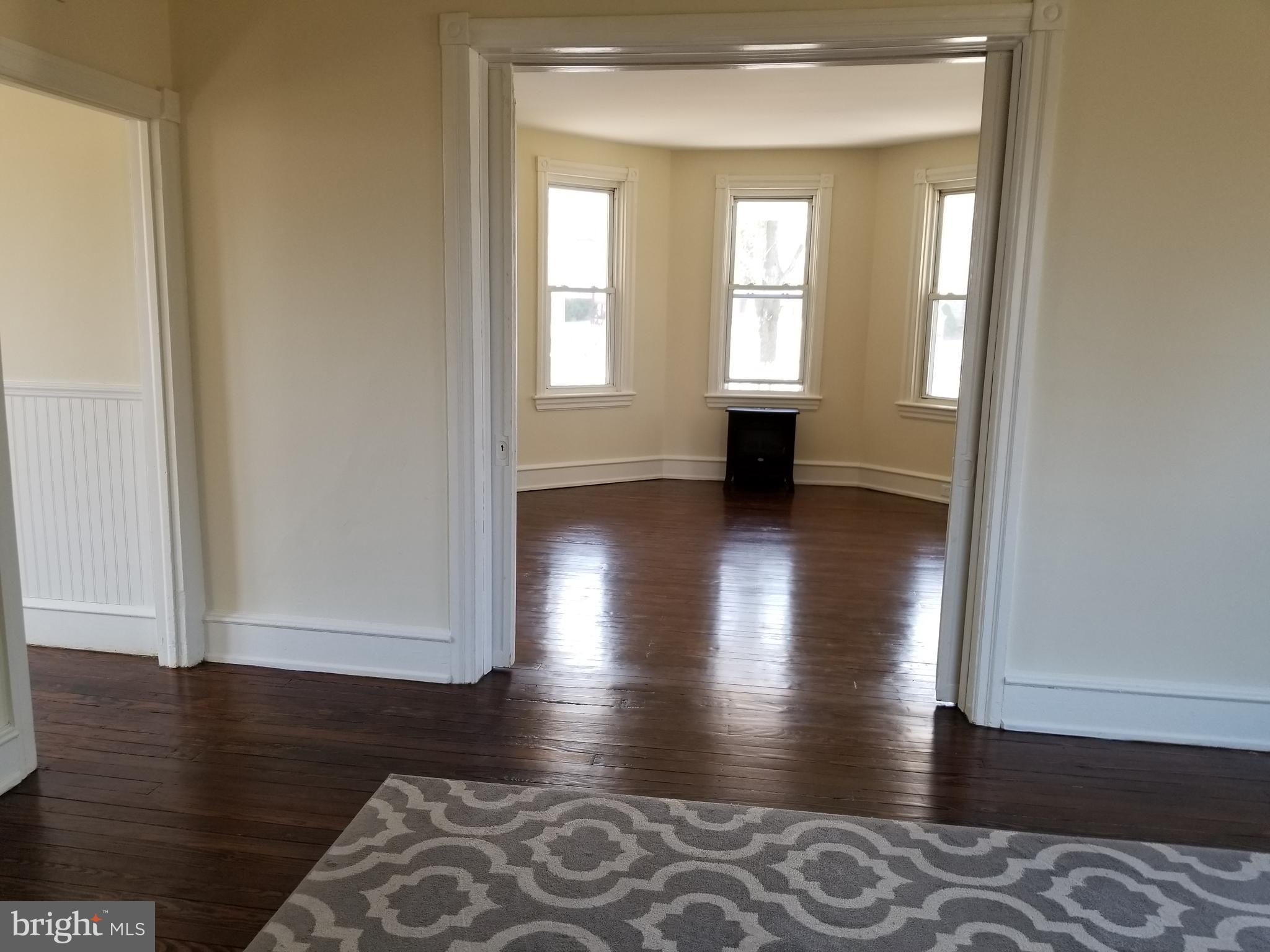 100 Main Street Bridgeport, NJ 08014 - Photo 6 of 24 Family Room to Living Room