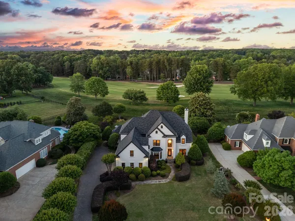 an aerial view of a house with a garden