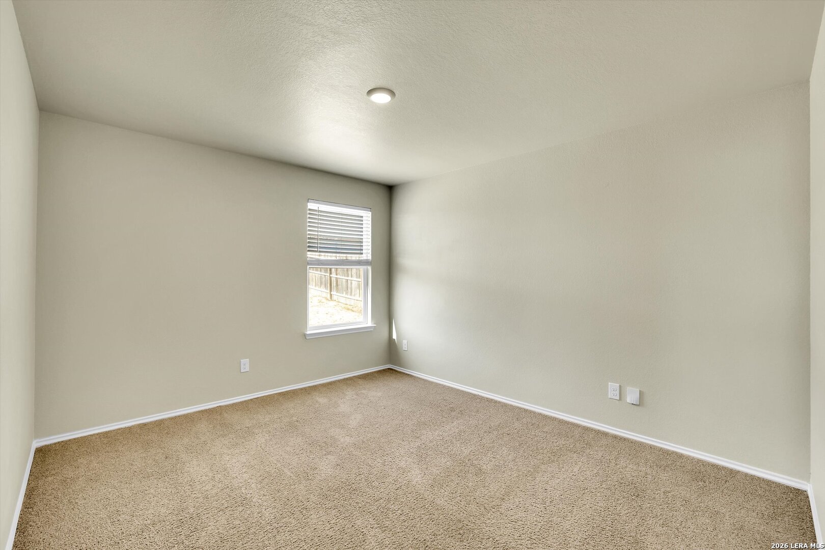 7639 Hercules Point San Antonio, TX 78252 - Photo 12 of 28 a view of an empty room with a window