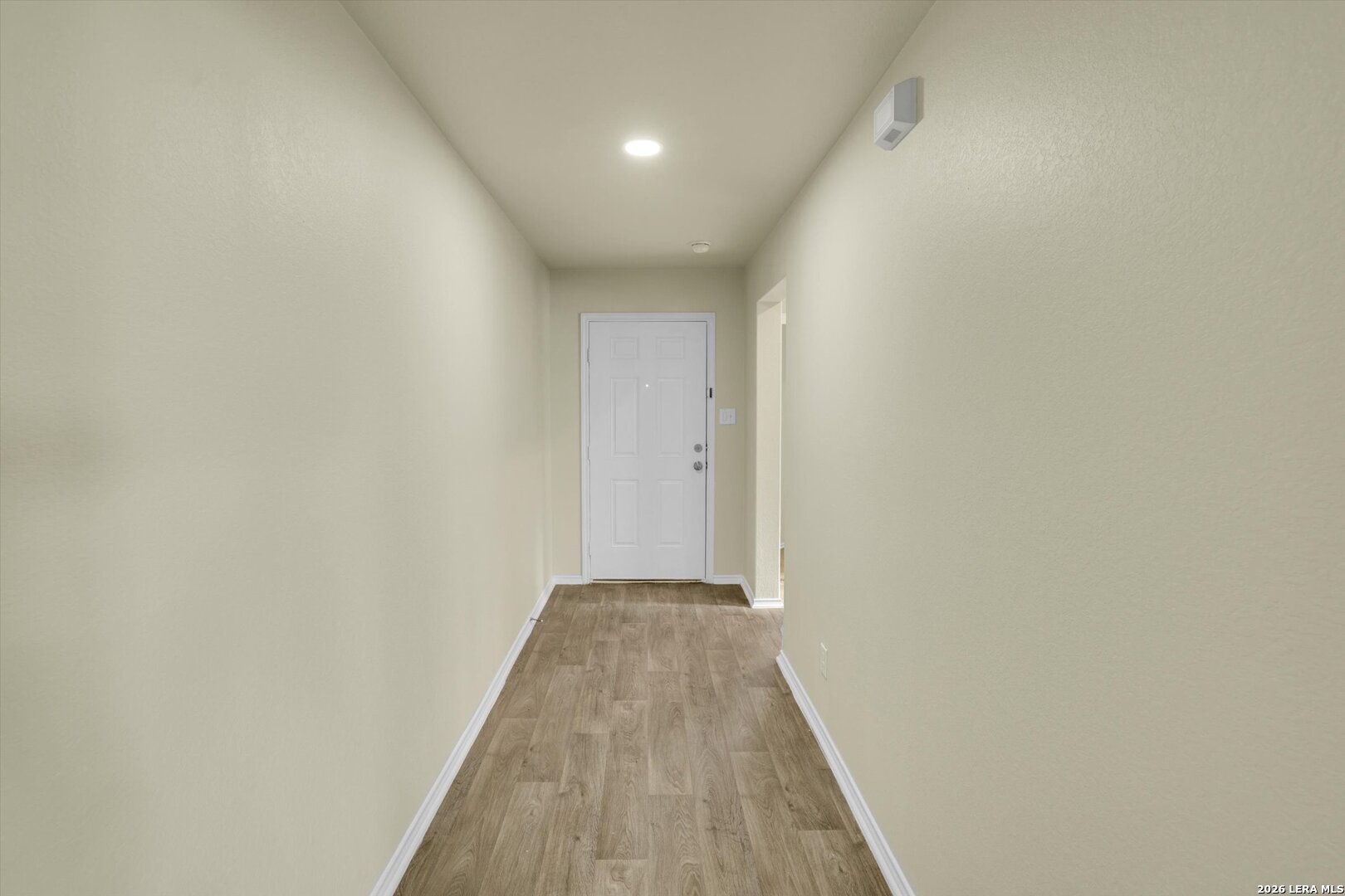 7639 Hercules Point San Antonio, TX 78252 - Photo 3 of 28 a view of a hallway with wooden floor