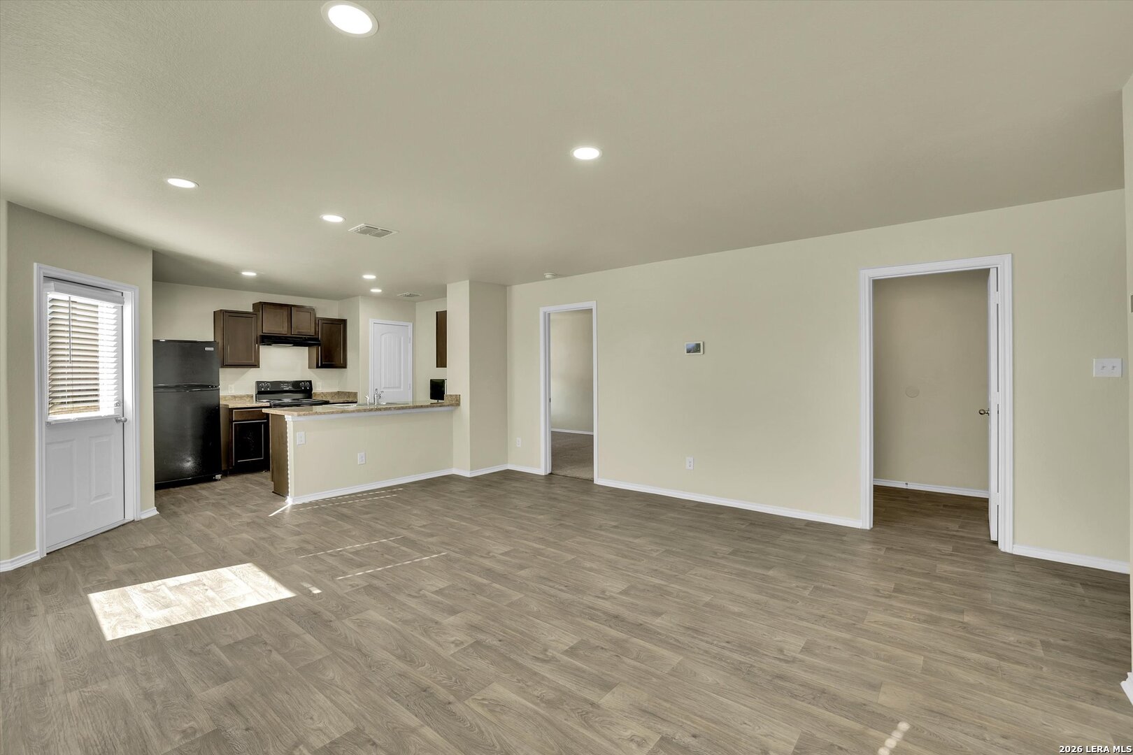 7639 Hercules Point San Antonio, TX 78252 - Photo 7 of 28 a view of kitchen with refrigerator sink and stove