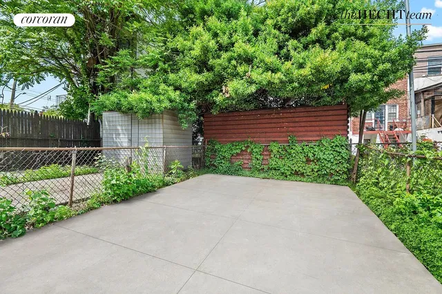 a view of bushes and pathway