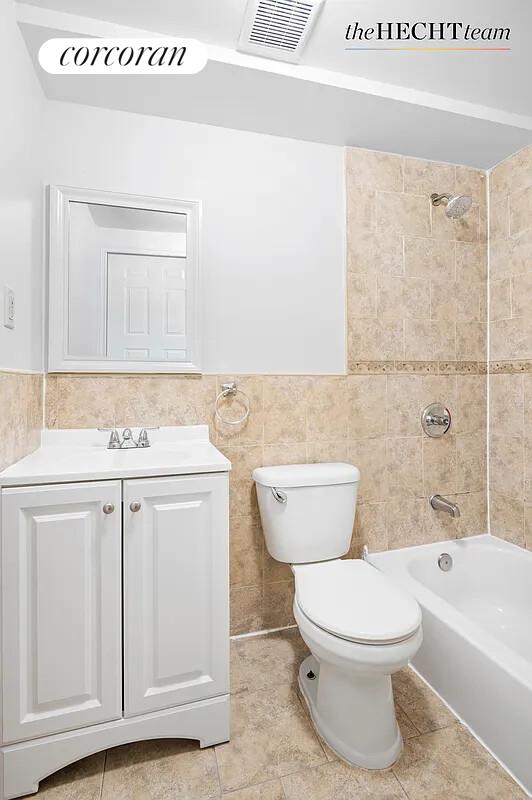 52 East 55th Street, Unit 2FAM Brooklyn, NY 11203 - Photo 10 of 12 a bathroom with a sink a toilet and bathtub