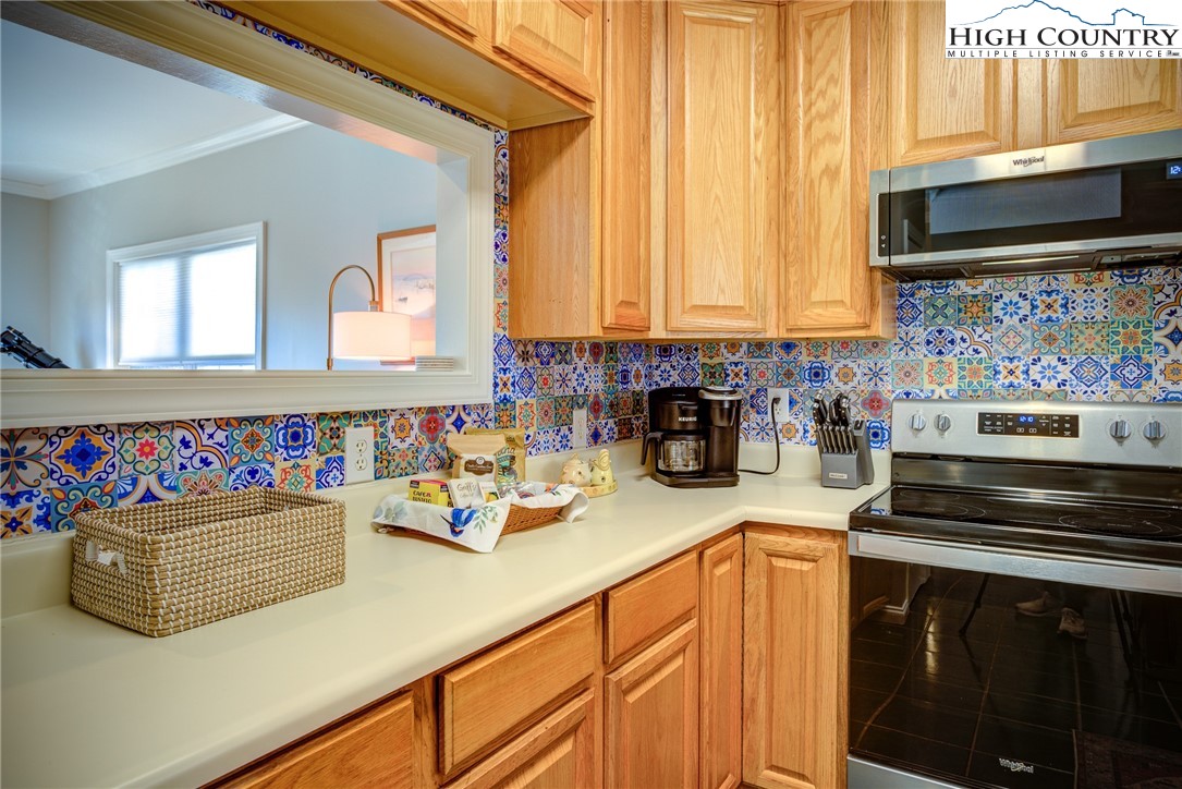 259 Ridge View Drive, Unit A Boone, NC 28607 - Photo 16 of 29 a kitchen with stainless steel appliances a stove a sink and a microwave