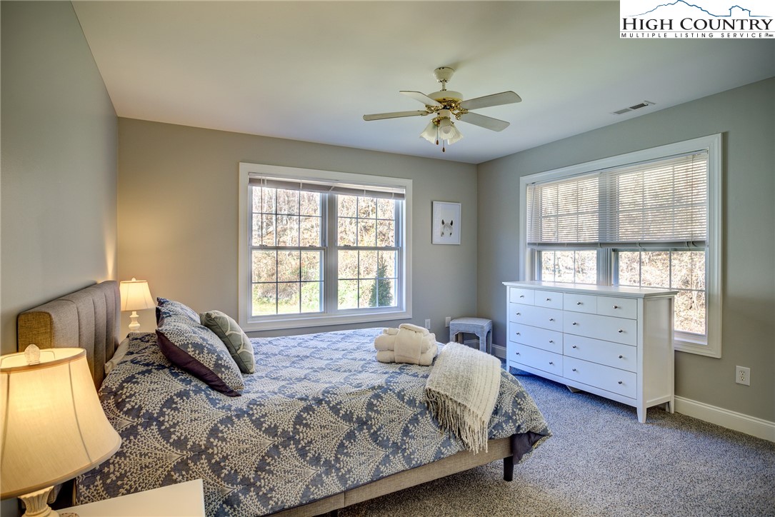 259 Ridge View Drive, Unit A Boone, NC 28607 - Photo 23 of 29 a bedroom with a bed and a window