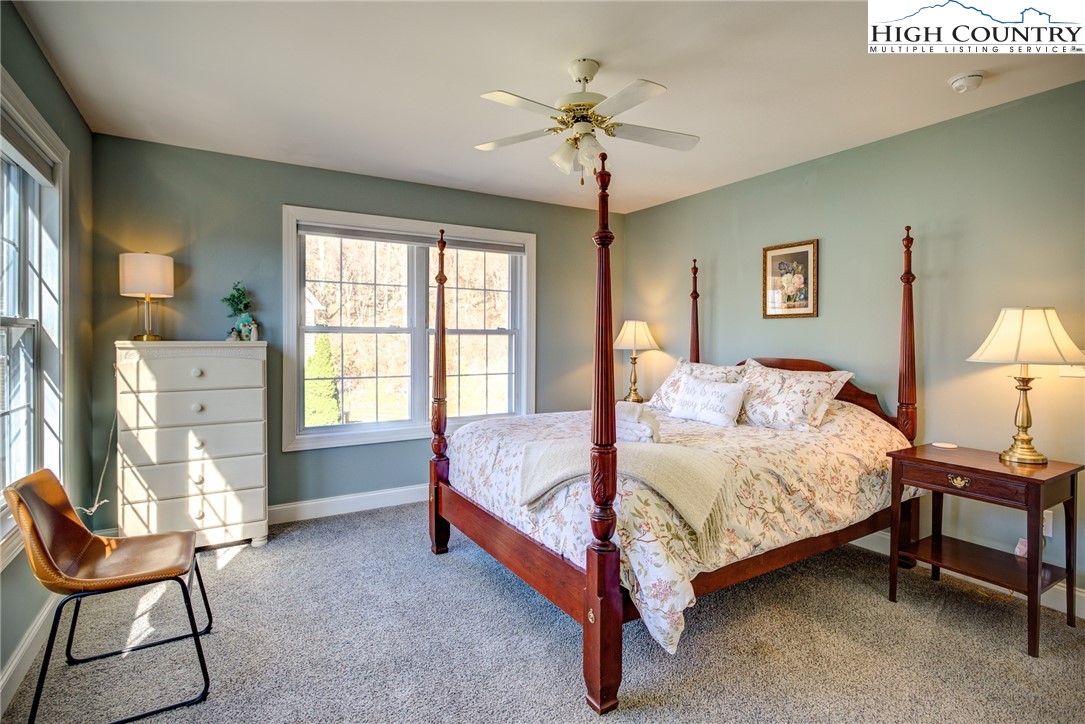 259 Ridge View Drive, Unit A Boone, NC 28607 - Photo 27 of 29 a bed room with a bed and a chair