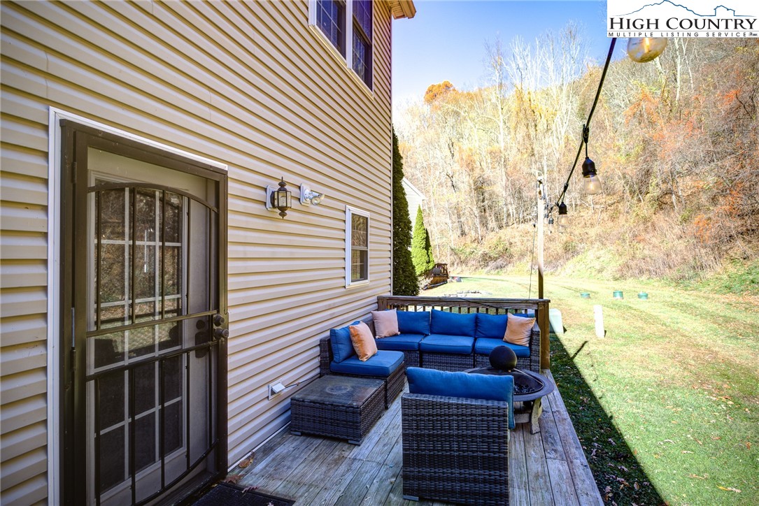 259 Ridge View Drive, Unit A Boone, NC 28607 - Photo 8 of 29 a view of a couches on the roof deck