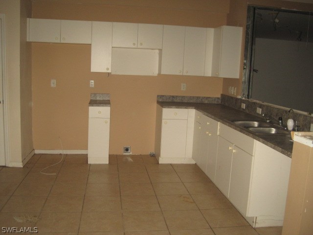 3805 22nd Street Southwest Lehigh Acres, FL 33976 - Photo 2 of 11 a kitchen with a sink and cabinets