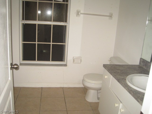 3805 22nd Street Southwest Lehigh Acres, FL 33976 - Photo 6 of 11 a bathroom with a toilet and a sink