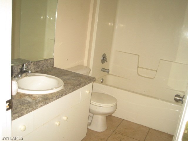 3805 22nd Street Southwest Lehigh Acres, FL 33976 - Photo 9 of 11 a bathroom with a sink a toilet and shower