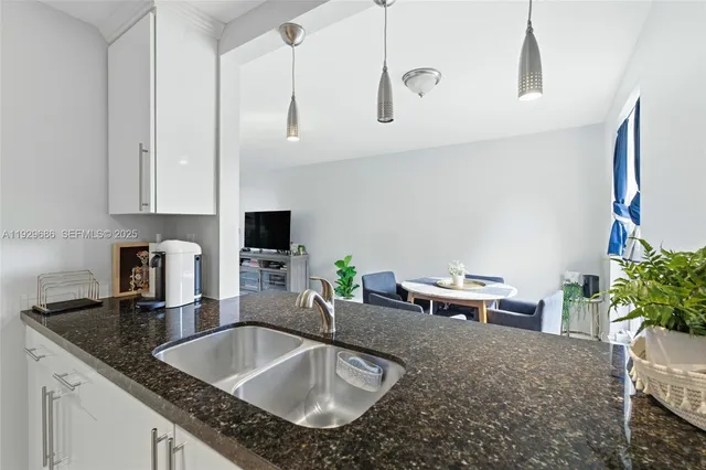 a hallway with a couch and cabinets