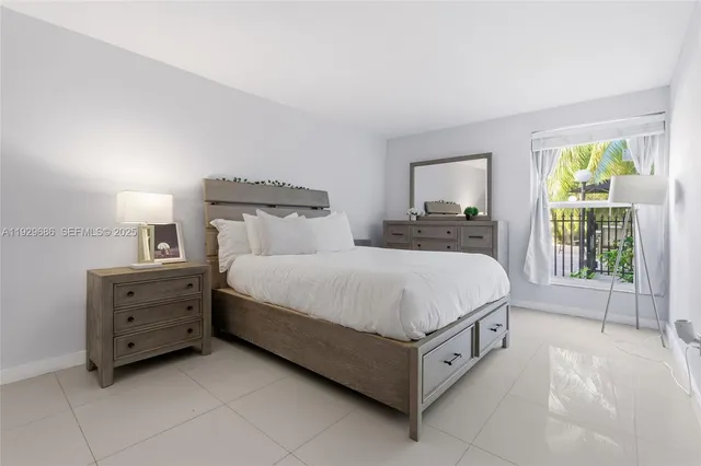 a bedroom with a bed and a chair