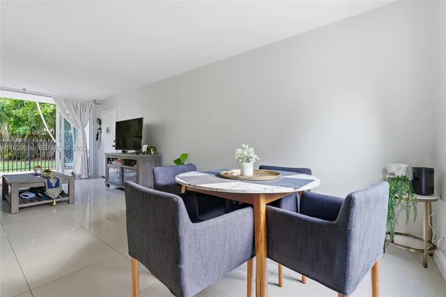 a view of a livingroom with furniture and a flat screen tv