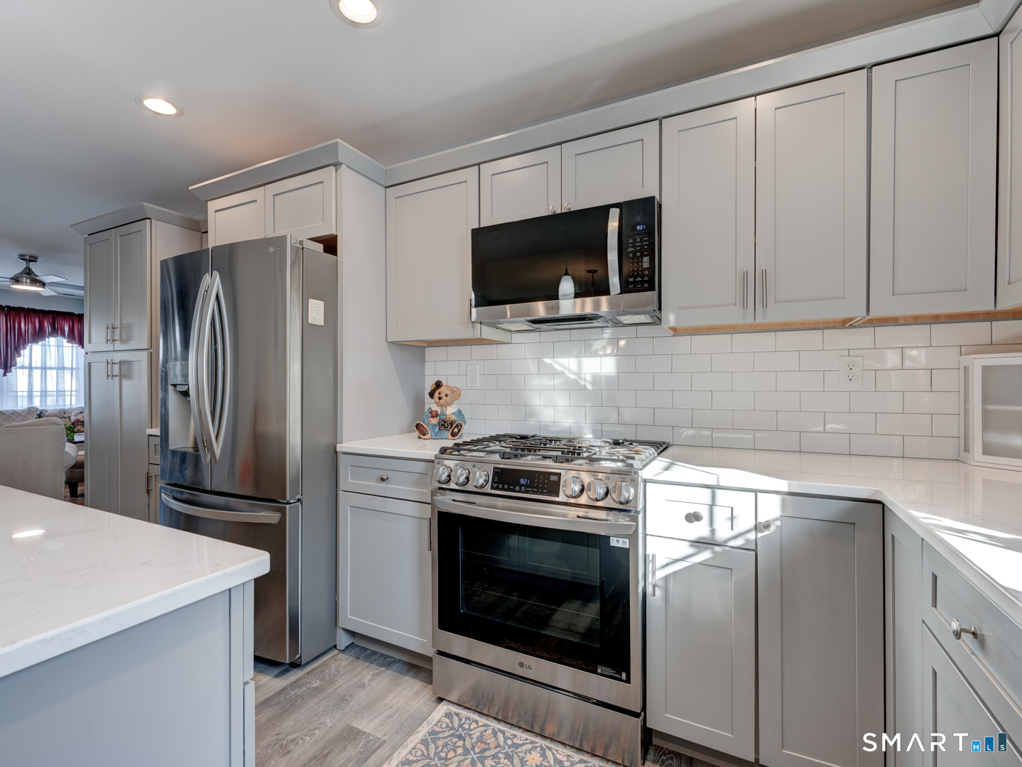 23 Hannah Way Harwinton, CT 06791 - Photo 12 of 40 a kitchen with stainless steel appliances a stove a microwave and cabinets