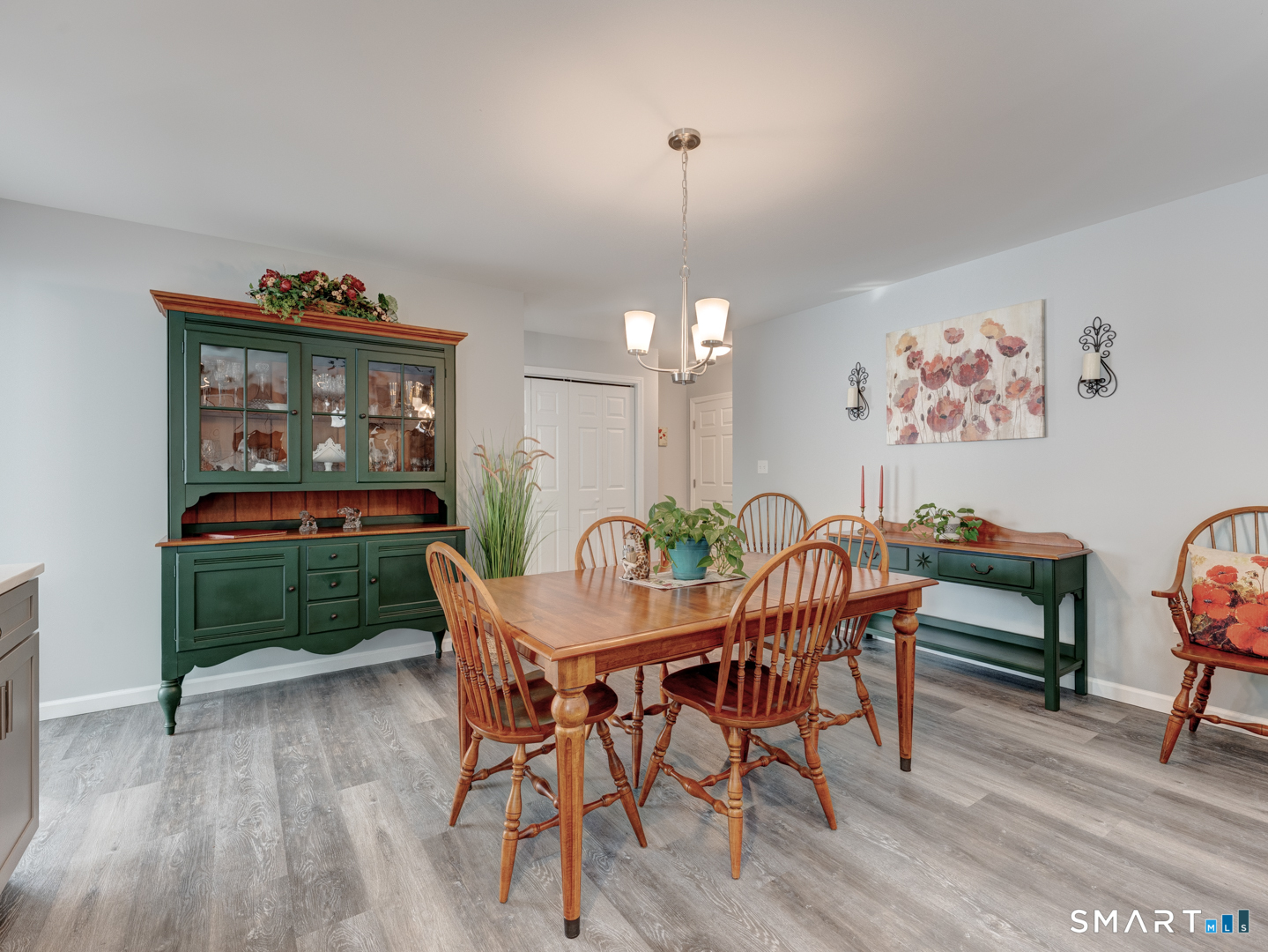23 Hannah Way Harwinton, CT 06791 - Photo 13 of 40 a view of a dining room with furniture a chandelier and wooden floor