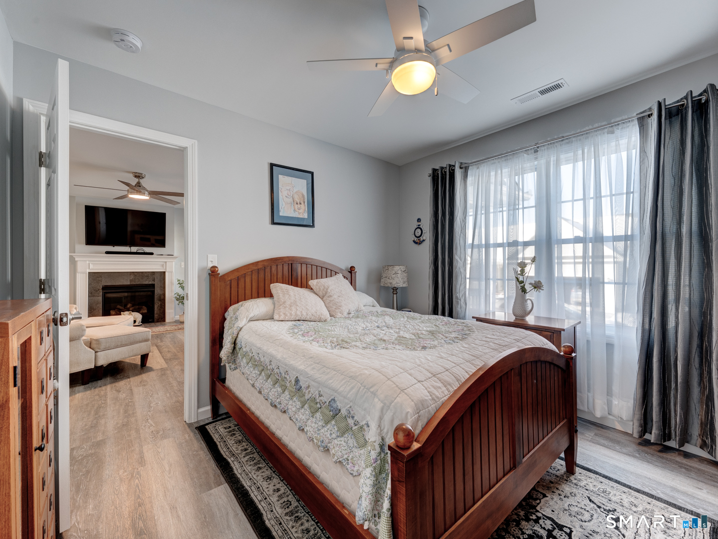 23 Hannah Way Harwinton, CT 06791 - Photo 24 of 40 a bedroom with a bed and a flat screen tv