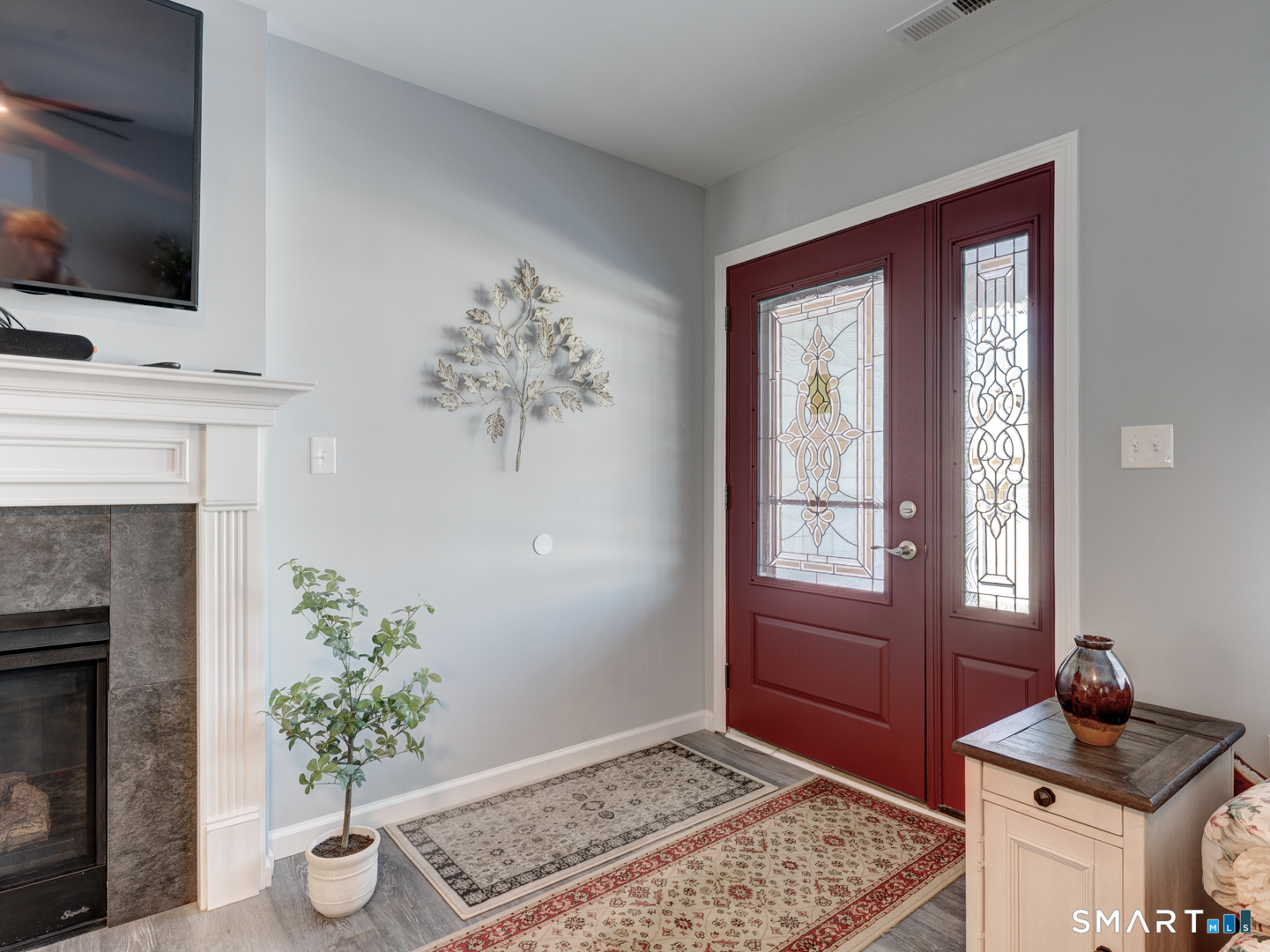 23 Hannah Way Harwinton, CT 06791 - Photo 3 of 40 a living room with furniture and a fireplace