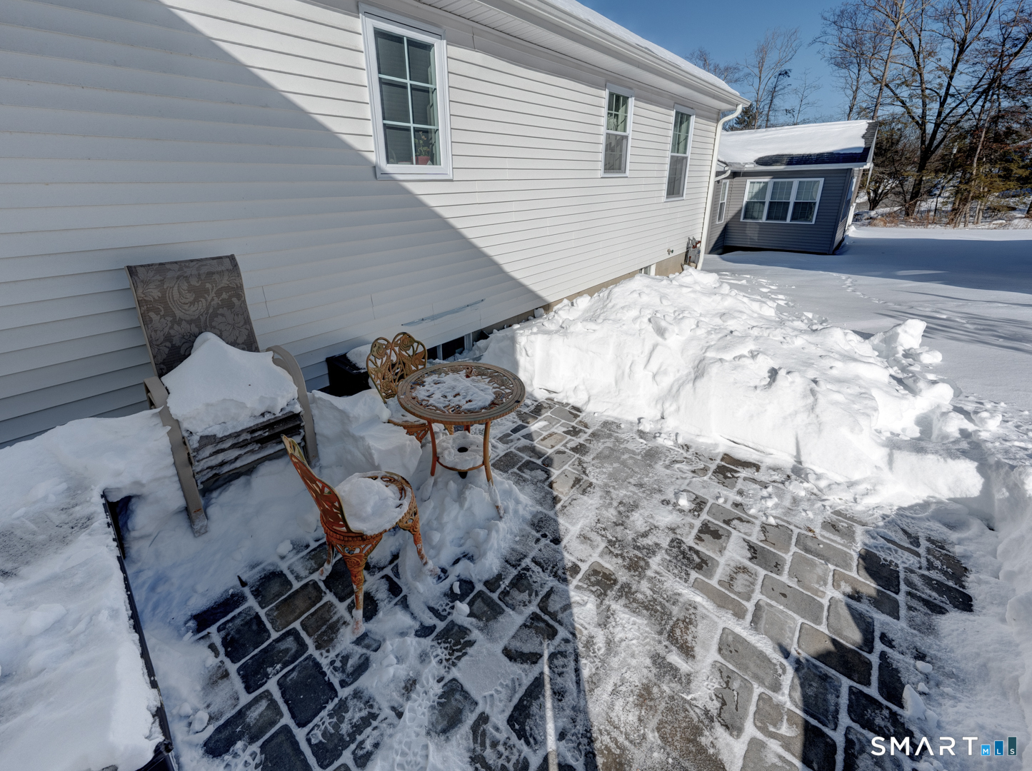 23 Hannah Way Harwinton, CT 06791 - Photo 32 of 40 a backyard of a house with wooden bench and chairs