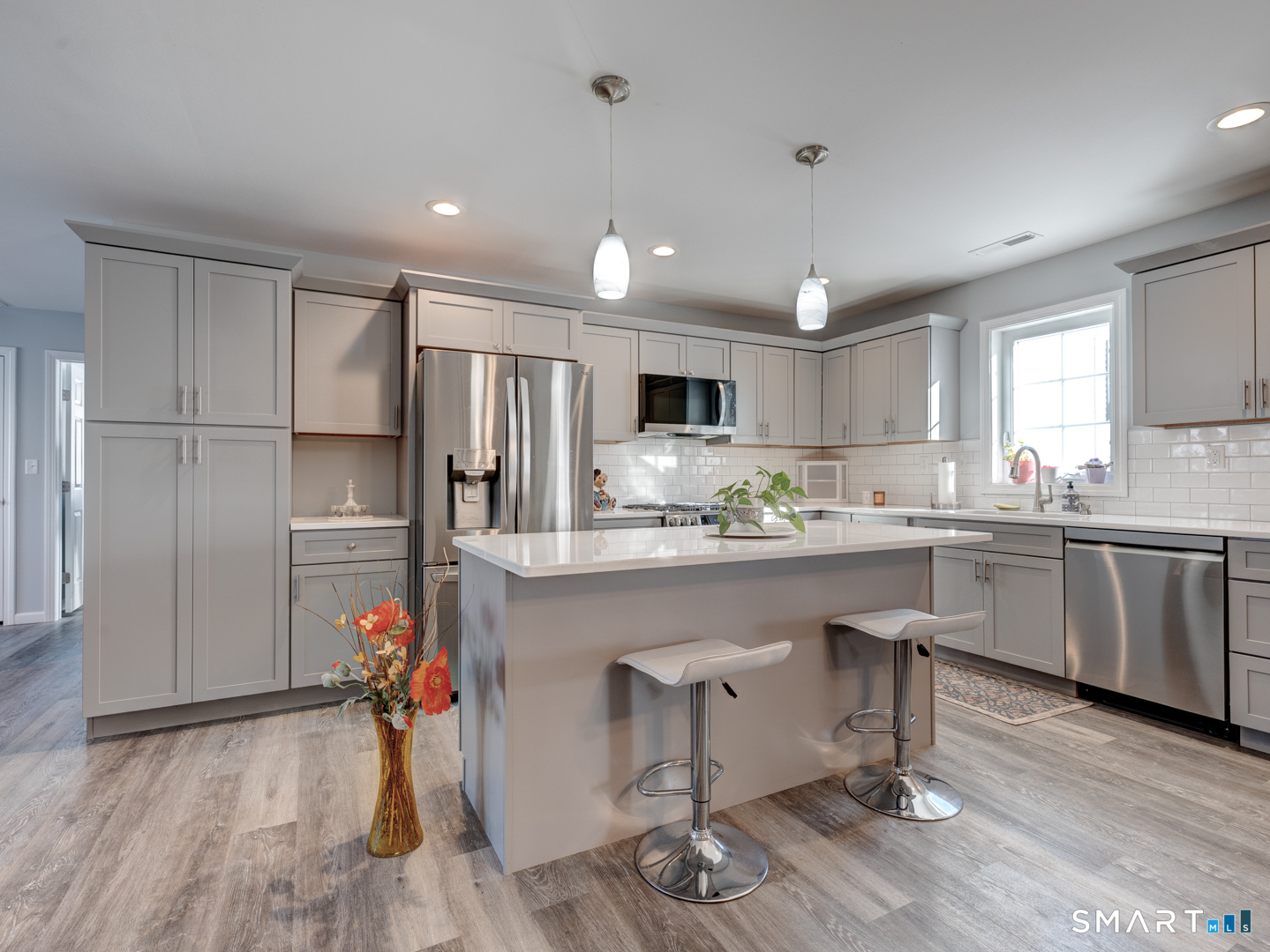 23 Hannah Way Harwinton, CT 06791 - Photo 6 of 40 a kitchen with stainless steel appliances granite countertop a refrigerator and a stove top oven