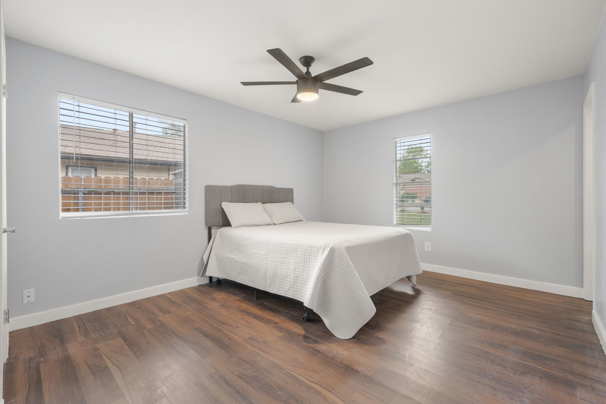 3917 Leafield Drive Austin, TX 78749 - Photo 16 of 40 Bedroom with dark wood finished floors and ceiling fan