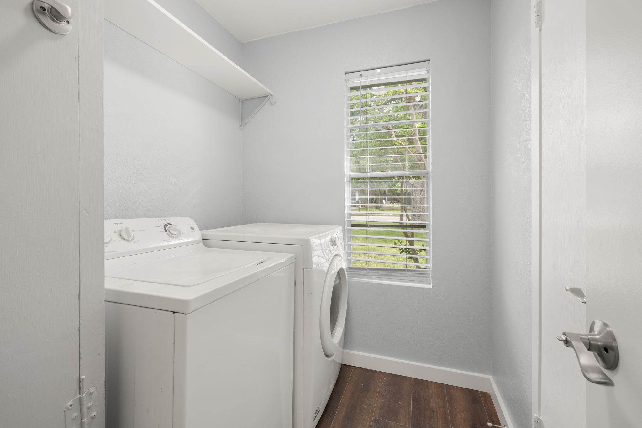 3917 Leafield Drive Austin, TX 78749 - Photo 22 of 40 Laundry room featuring dark wood-style flooring and washing machine and clothes dryer