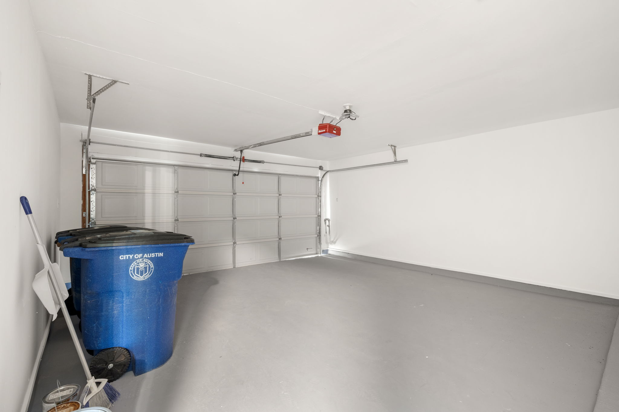 3917 Leafield Drive Austin, TX 78749 - Photo 23 of 40 Garage featuring a garage door opener