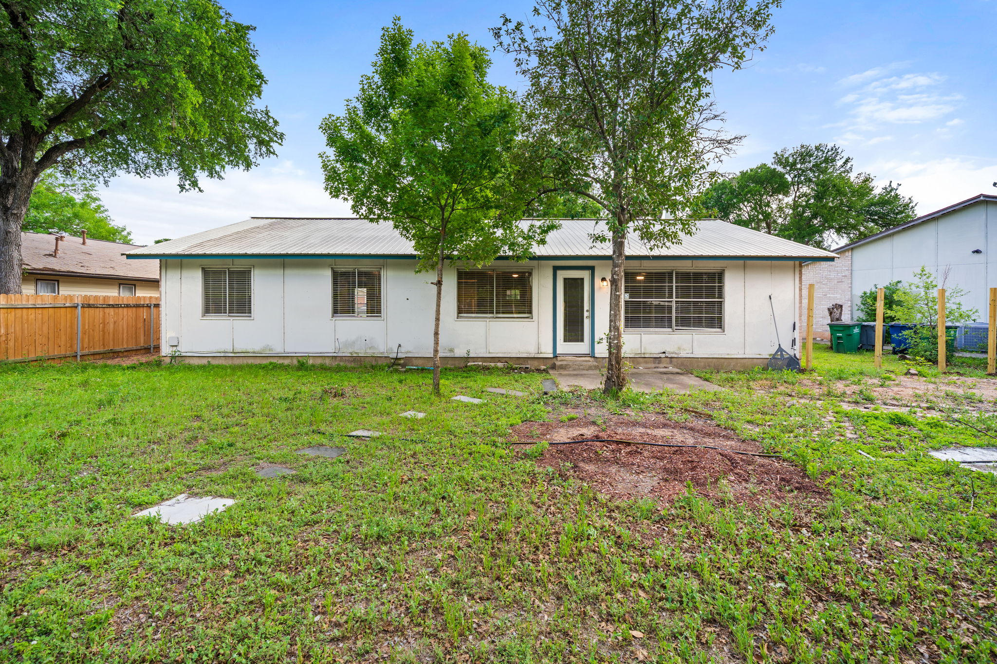 3917 Leafield Drive Austin, TX 78749 - Photo 24 of 40 Back of property featuring a metal roof