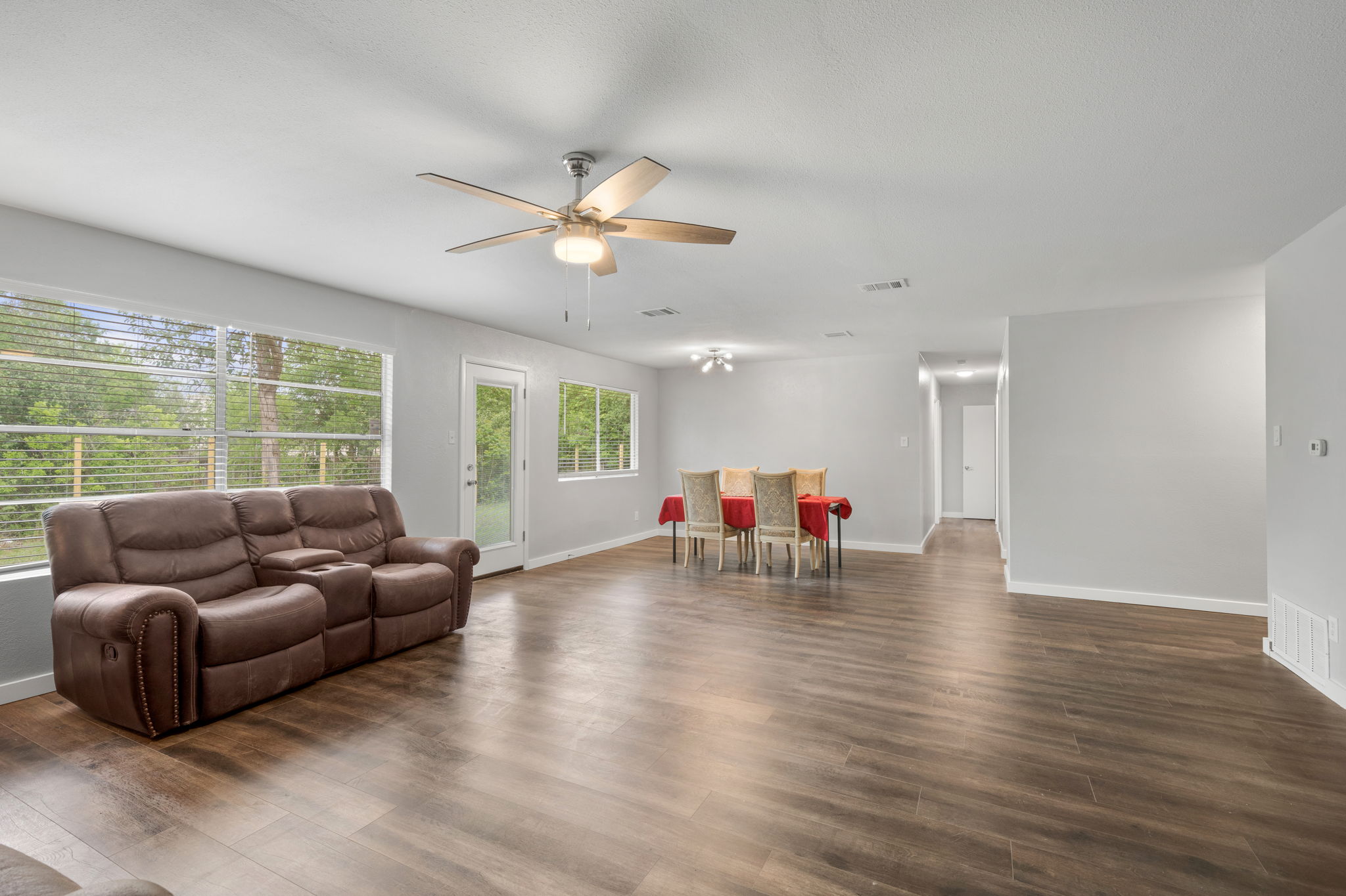 3917 Leafield Drive Austin, TX 78749 - Photo 27 of 40 Living room with dark wood finished floors and ceiling fan