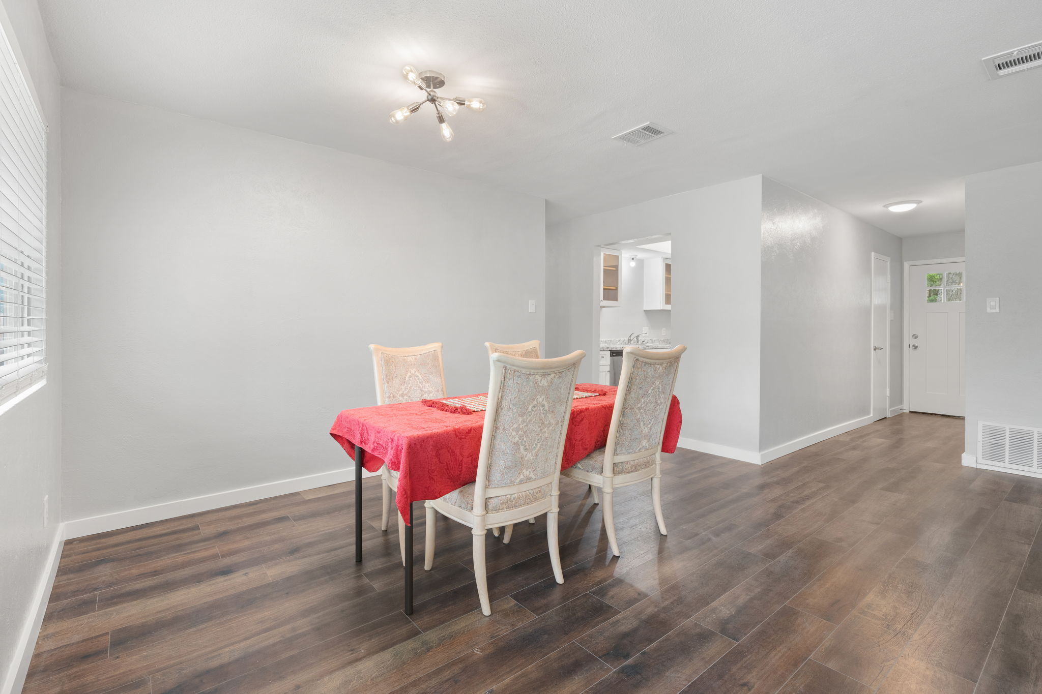 3917 Leafield Drive Austin, TX 78749 - Photo 30 of 40 Dining room with dark wood-type flooring and hanging lights