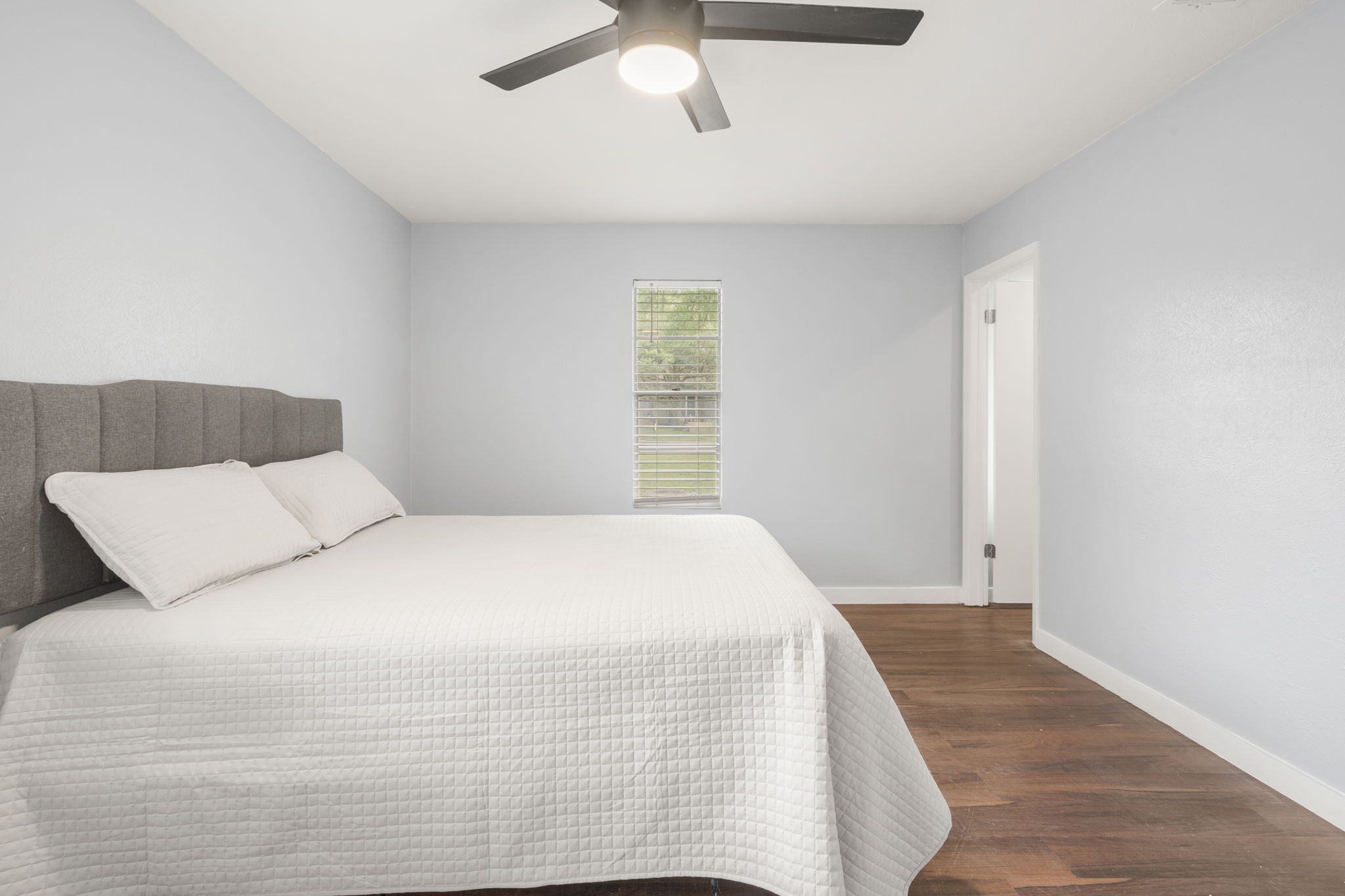 3917 Leafield Drive Austin, TX 78749 - Photo 31 of 40 Bedroom featuring dark wood finished floors and a ceiling fan
