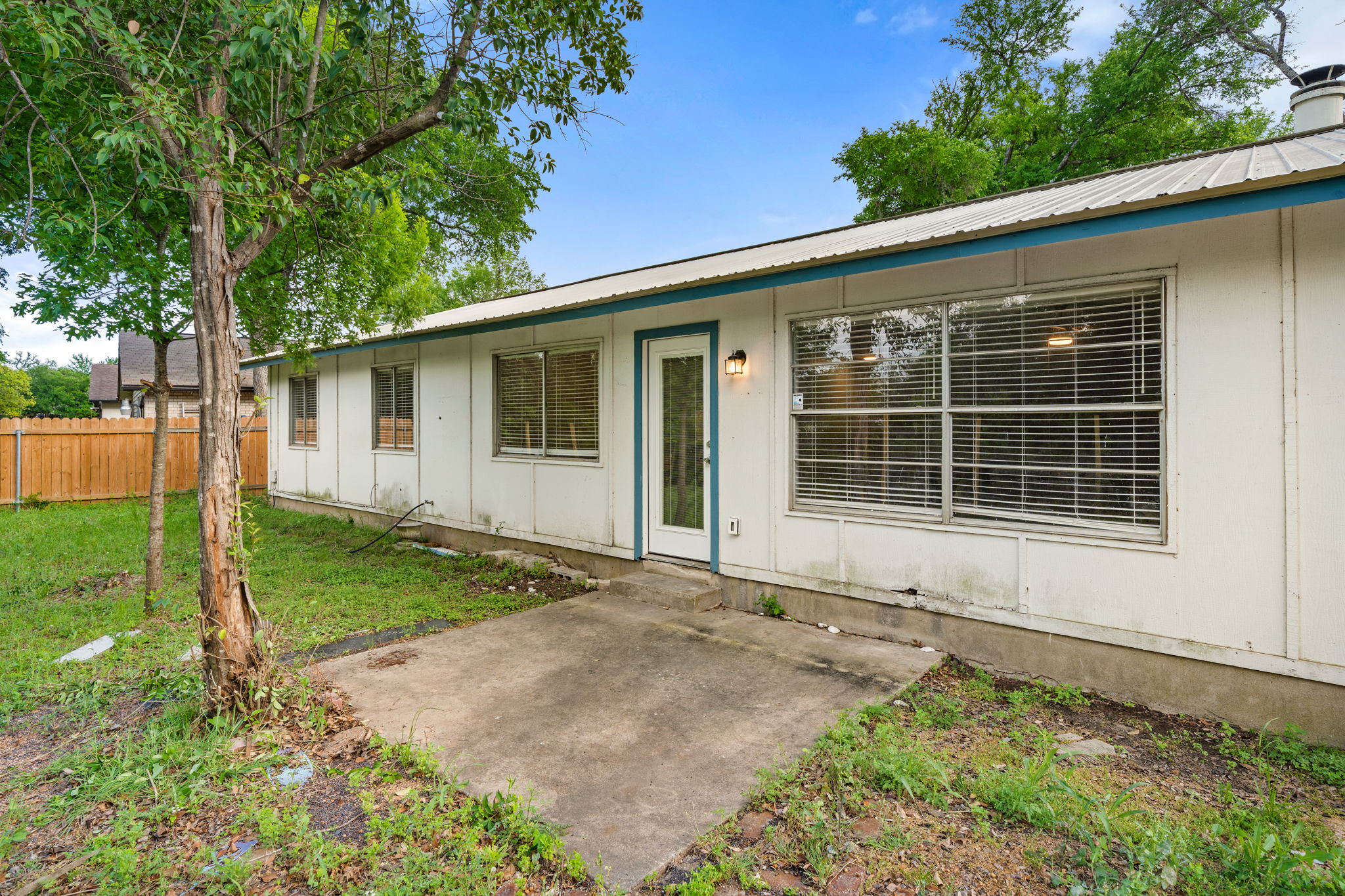 3917 Leafield Drive Austin, TX 78749 - Photo 32 of 40 Doorway to property featuring a patio and a metal roof