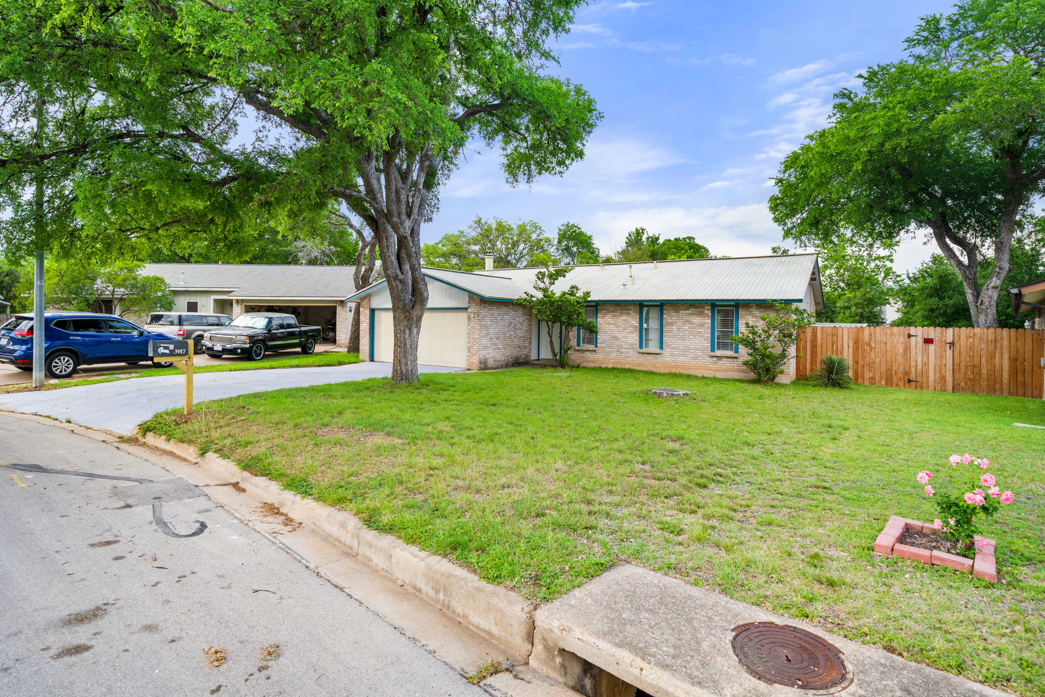 3917 Leafield Drive Austin, TX 78749 - Photo 39 of 40 Single story home featuring a garage, driveway, and brick siding