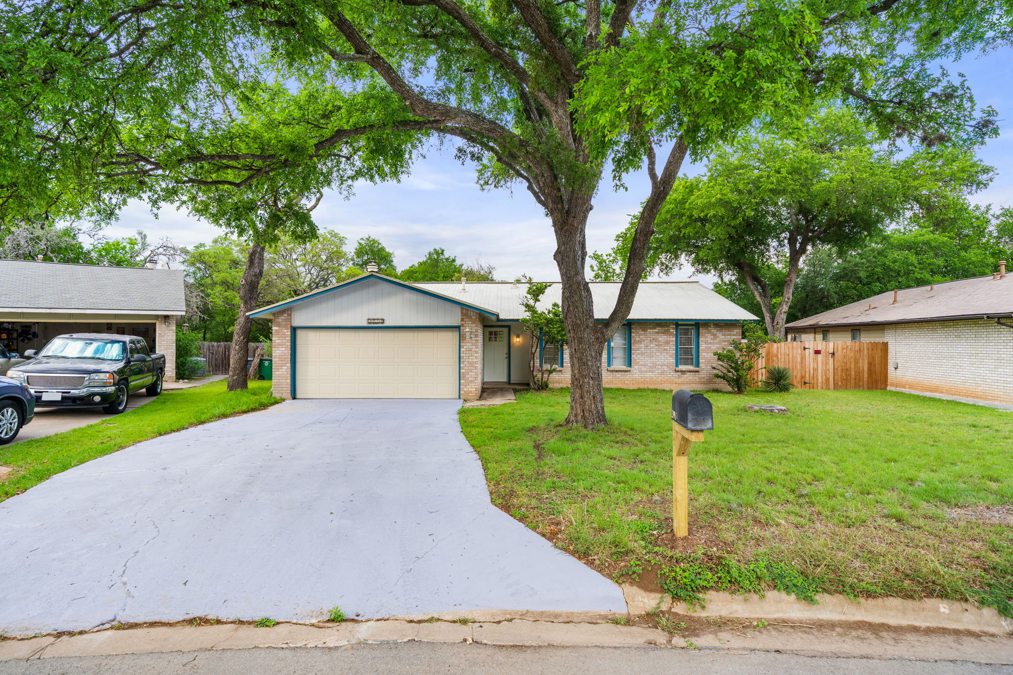 3917 Leafield Drive Austin, TX 78749 - Photo 40 of 40 Ranch-style home featuring a garage, brick siding, and driveway