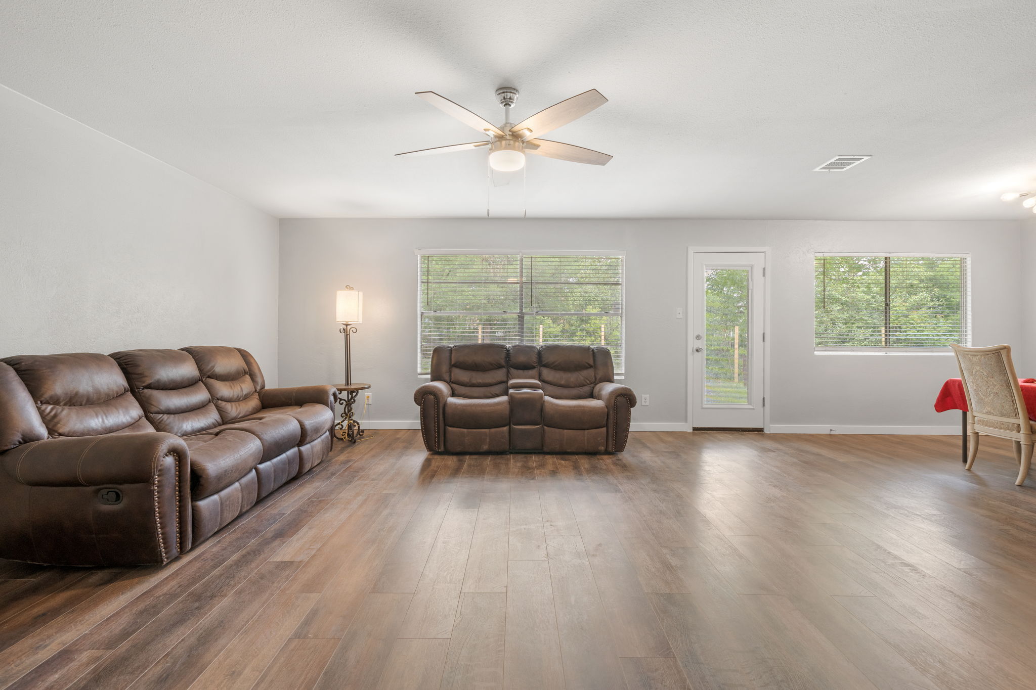 3917 Leafield Drive Austin, TX 78749 - Photo 7 of 40 Over sized living area featuring dark wood-type flooring and a ceiling fan