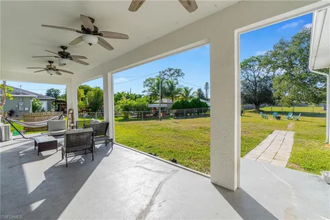a view of an swimming pool and trees in the background