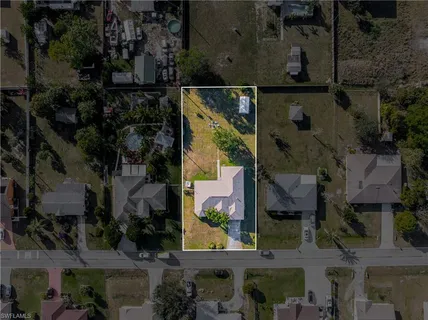 an aerial view of a house with a garden