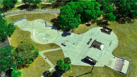 an aerial view of a residential houses with outdoor space