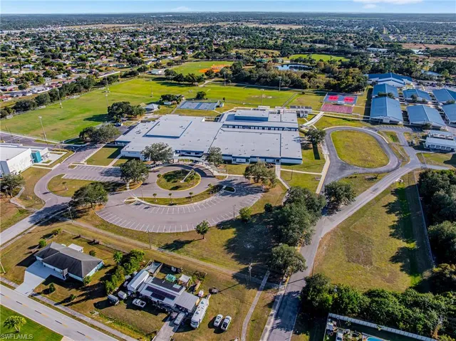 an aerial view of a swimming pool with a swimming pool