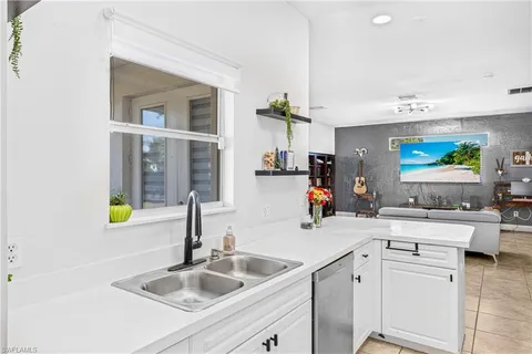 a kitchen with sink cabinets and counter