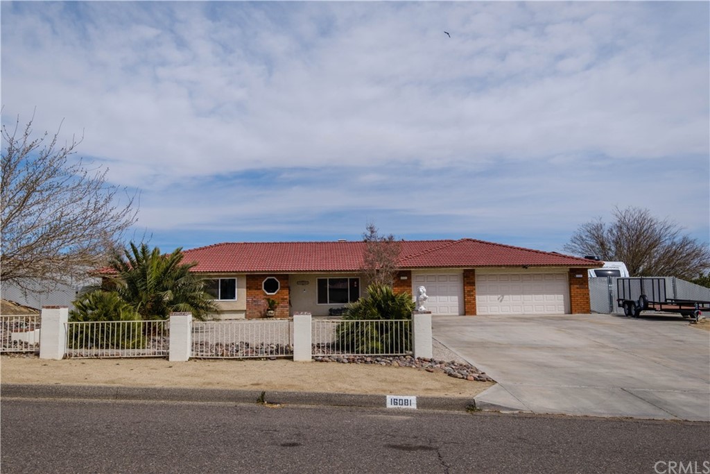 16081 Tude Road Apple Valley, CA 92307 - Photo 1 of 1 a front view of house with yard