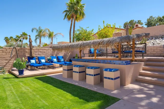 a view of a house with backyard porch and patio